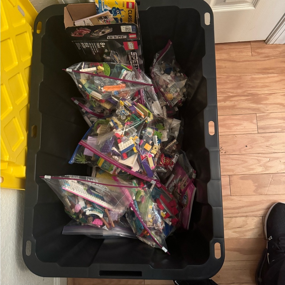 Assorted LEGO Pieces in Black Storage Bin